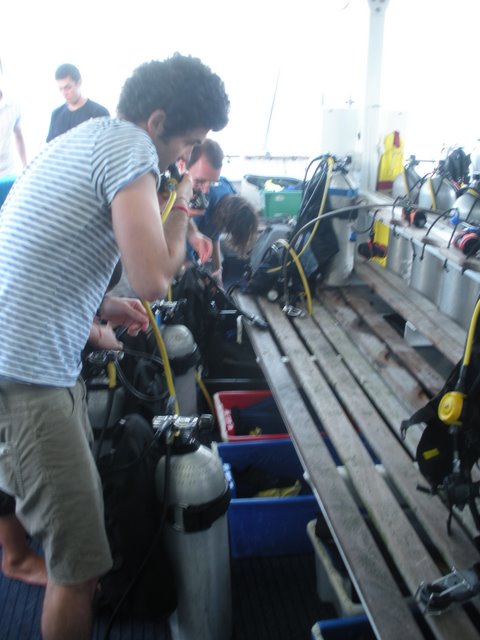 Andrea my scuba buddy checking out his gear on the back of the boat